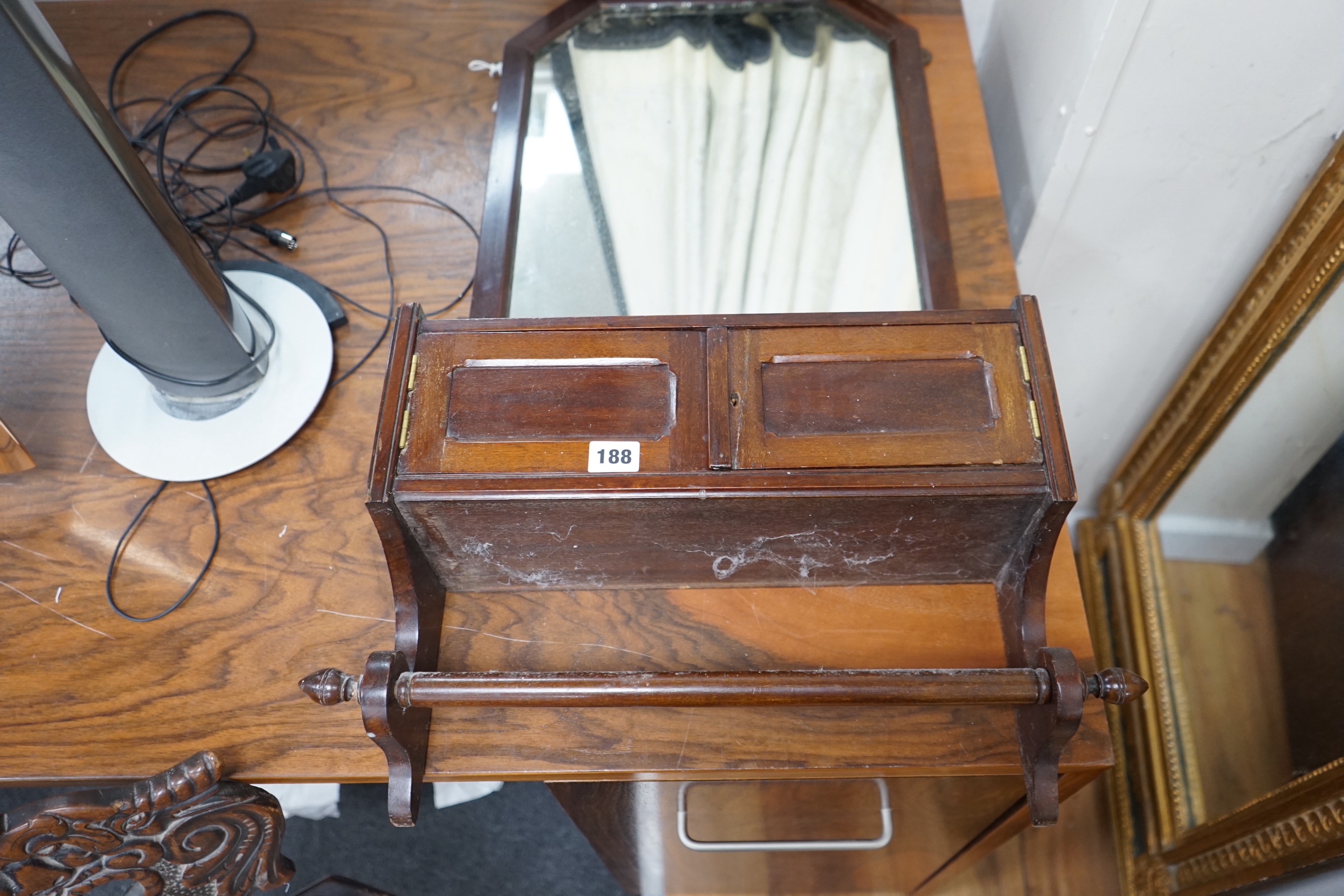 A 19th century German carved oak and beech spinning chair and an Edwardian wall mirror with hanging rail.